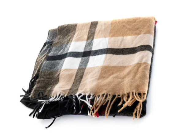 Tartan shawl in front of white background,